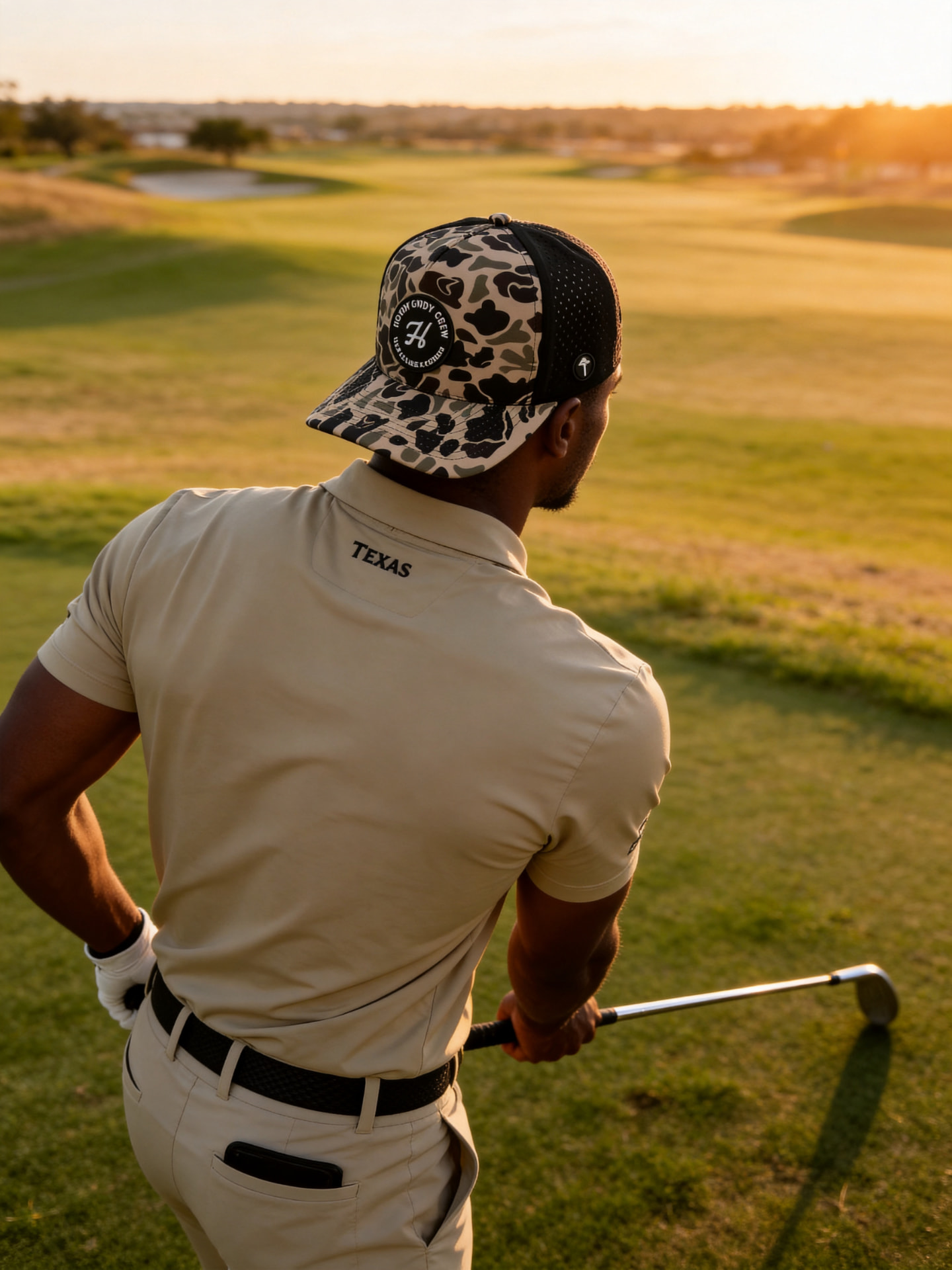 Golfer on the tee box wearing the duck camo Howdy Golf Crew patch hat